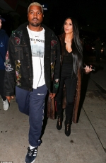 Kim Kardashian wears long fur coat as she steps out for romantic dinner