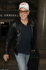 Father-to-be George Clooney sports leather jacket