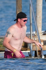 Red-faced Man United star reveals embarrassing T-shirt marks as he goes shirtless after a day