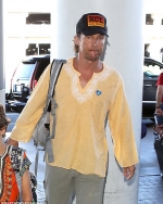 Matthew McConaughey and Camila Alves jet out of LA with their bohemian tribe of kids