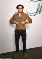 Brooklyn Beckham cuts a stylish figure in a suede jacket and skinny jeans