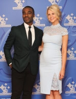Ore Oduba poses proudly with his pregnant wife Portia at the National Lottery Awards...