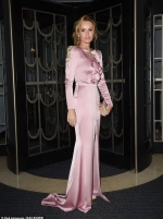 Amanda Holden oozes glamour in pink satin gown as she braves the elements