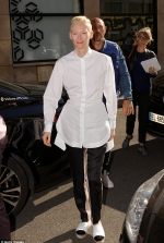 Tilda Swinton, 56, embraces her trademark androgynous style as she rocks an oversized shirt