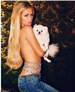 Paris Hilton poses topless on Instagram...covered only by her beloved