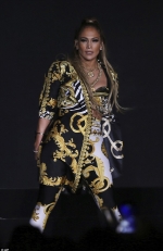 Jennifer Lopez, 48, shows off her fit figure in a Versace  Read
