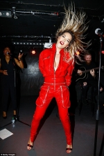 Lively Rita Ora flashes major cleavage in racy unzipped jumpsuit...