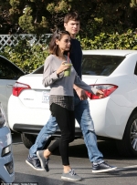 Mila Kunis and husband Ashton Kutcher coordinate in casual