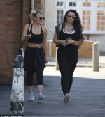 Danielle Armstrong flaunts her toned abs in a sports bra as she heads