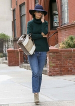Katie Holmes keeps a low profile in large floppy hat and shades