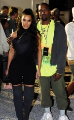 Kim Kardashian looks every inch the proud wife as she supports