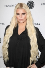 Jessica Simpson defends video of her husband flipping their son