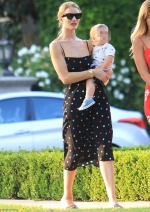 Rosie Huntington Whiteley looks like a vision in spotted sundress during
