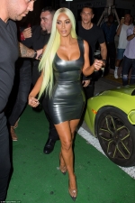 Kim Kardashian debuts neon GREEN locks and shows off her bulbous buttocks in a VERY