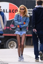 Stella Maxwell rocks a denim jacket and shorts with ripped tights