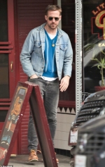 Ryan Gosling is ruggedly handsome in denim jacket and faded jeans as he