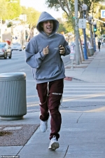 Justin Bieber looks excited as he sprints to massage after leaving