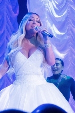 Mariah Carey dazzles in plunging white gown with thigh-high split