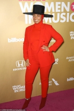Alicia Keys stands out from the stars in a bright red kooky outfit at Billboard's