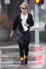 Kristen Stewart visits a hair salon in the LA rain as she steps out without
