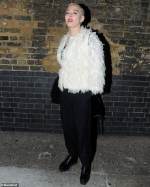 Rose McGowan looks fashionable in a feathered jacket after sharing
