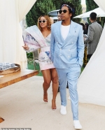 Beyonce makes an impact with oversized shoulders as she and Jay-Z lead