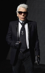 Karl Lagerfeld, 85, displays missing teeth as he flashes a broad grin