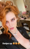 Bella Thorne teases her décolletage as she goes topless under black satin robe to promote her OnlyFans