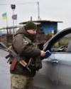 Military vehicles, armed men stay in center of occupied Luhansk - OSCE SMM