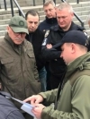Law enforcers at Olimpiyskiy stadium discuss possible presidential debate. Photos